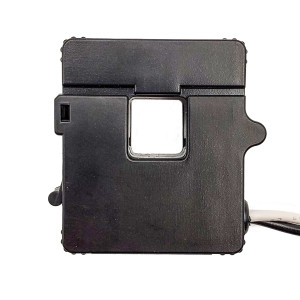 Black rectangular current transformer with a small square opening in the center and a white and black cable extending from the side.