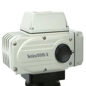 Grey rectangular actuator with ribbed sides and a prominent black knob on front