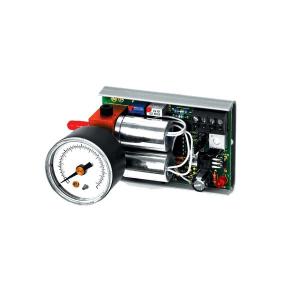 Electronic circuit board with two horizontal silver cylinders, an attached round gauge and wiring connections.