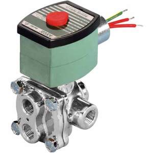 Photograph of a compact stainless steel solenoid valve with a green coil housing and red push button on top, used for controlling fluid or gas.